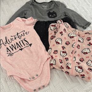 0-3 months black cat dress. Hello kitty PJ and a pink onesie.
